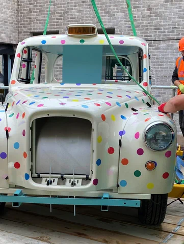 Give us a lift! London taxi gets cabbied away on a caffeine high by Brogan as it travels to its new location on roof-top cafe